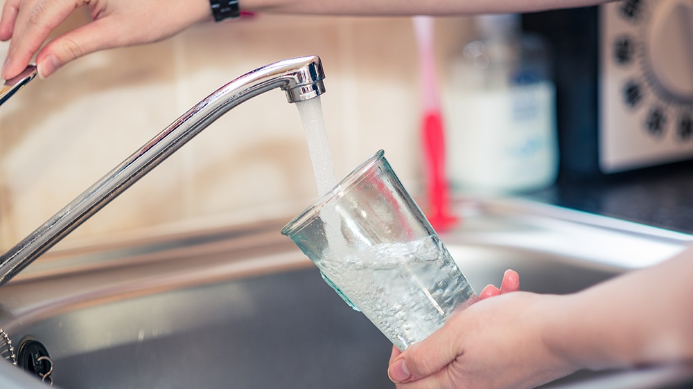 filling glass with tap water